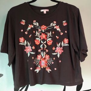 brown top with embroidered flowers